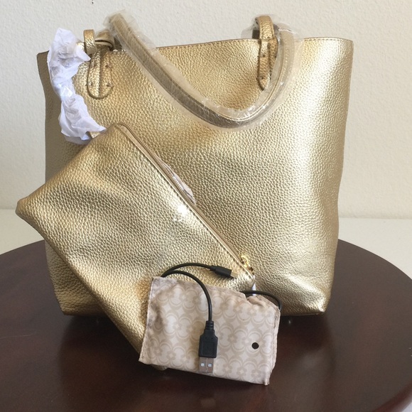 Charming Charlie Handbags - GOLD PURSE w/PHONE CHARGER